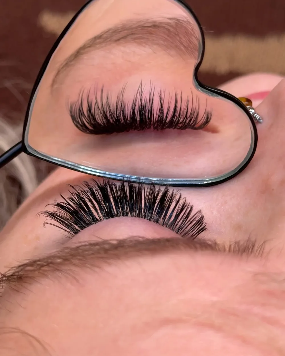 Wispy volume set seen through a heart-shaped mirror